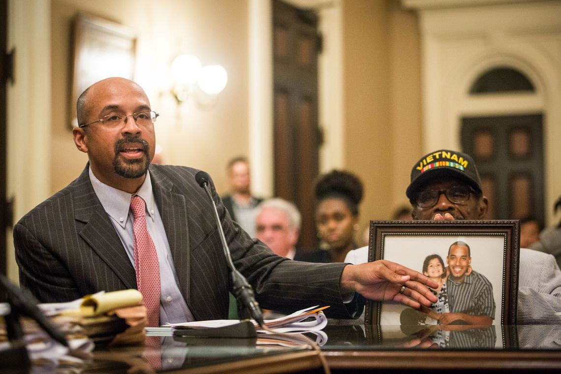 Jacque Wilson, left, and his father, Mack Wilson, right, testify about their brother and son Neko Wilson, during a California Assembly Public Safety Committee hearing on SB 1437 at the State Capitol. Neko Wilson is awaiting trial under the felony murder rule.