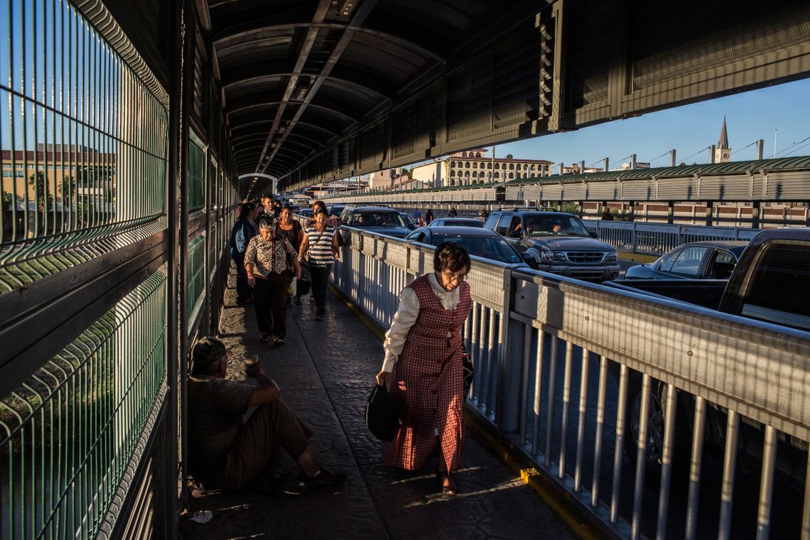 There is a constant flow of people, cars and commerce between Laredo and its twin city in Mexico, Nuevo Laredo. Many people live in Mexico and come over daily for work or school in Laredo. Often they have border crossing cards that allow them to enter the United States easily. On an October afternoon, people walked across the Gateway to the Americas bridge returning to Mexico. 