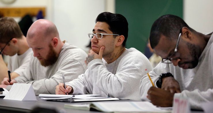 Men attending a college history class at the Monroe Correctional Complex in Monroe, Wash. Marlon Peterson, not pictured, argues that employers and those who craft re-entry programs must recognize the agency of those who have experienced incarceration.