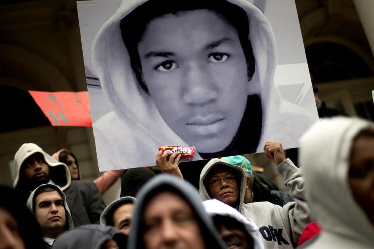 NEW YORK, NY - MARCH 28:  People along with New York City Council members attend a press conference to call for justice in the February 26 killing of 17-year-old Trayvon Martin in Sanford, Florida, on the steps of City Hall March 28, 2012 in New York City. Martin was killed by George Michael Zimmerman while on neighborhood watch patrol in the gated community of The Retreat at Twin Lakes.  (Photo by Allison Joyce/Getty Images)