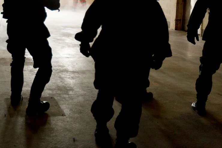 In this May 9, 2012 photo, a CERT team from the Cuyahoga County (Ohio) Sheriff’s Department moves in to arrest volunteers portraying inmates during a training scenario at the 16th annual Mock Prison Riot at the West Virginia Penitentiary in Moundsville, W.Va. (AP Photo/The Salt Lake Tribune, Trent Nelson)  DESERET NEWS OUT; LOCAL TV OUT; MAGS OUT