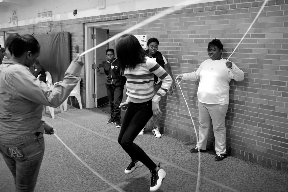 Tarza, right, turns the jump ropes as Jada skips Double Dutch.