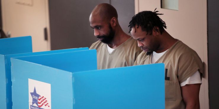 Prisoners at the Cook County Jail cast their votes in the Illinois primary election after a polling place in the facility was opened for early voting in early March of this year in Chicago.