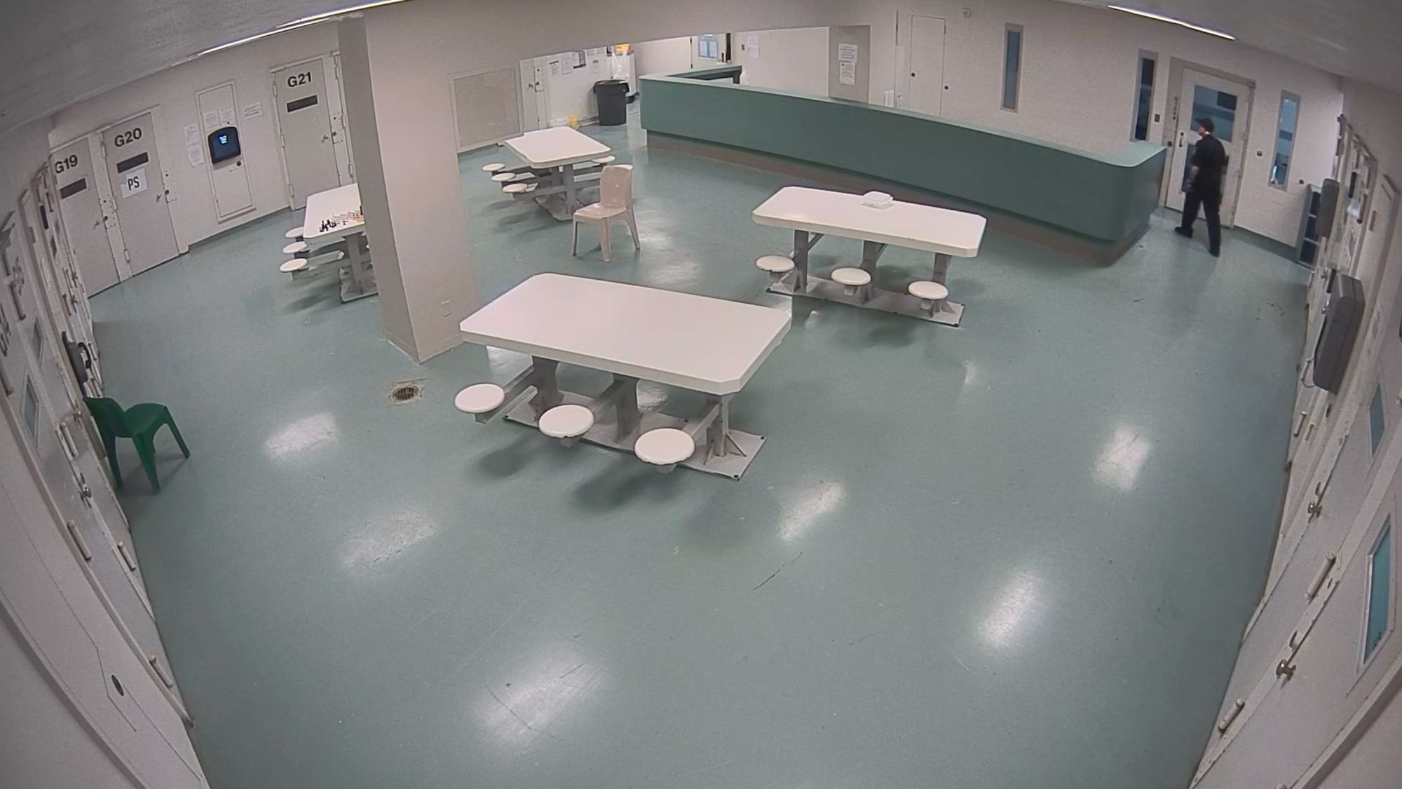 Three still images from surveillance footage show a jail pod. The first image shows a correctional officer looking into a cell. The second image shows the officer on the other side of the pod. The third image shows a group of officers and nurses outside an open cell door with a gurney. 
