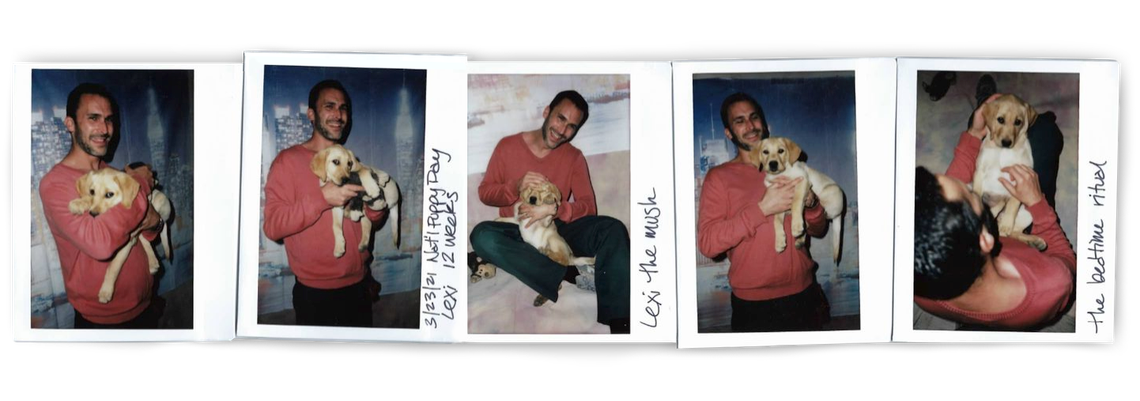 Five polaroids show a White man, in an orange and black prison uniform, holding a labrador retriever puppy. Captions on the sides of the polaroids read, "3/23/21 Nat'l Puppy Day, Lexi, 12 weeks," "Lexi the mush," and "The bedtime ritual."