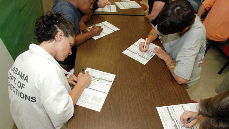 Prisoners fill out voter registration forms in a work-release center in Birmingham, Ala.