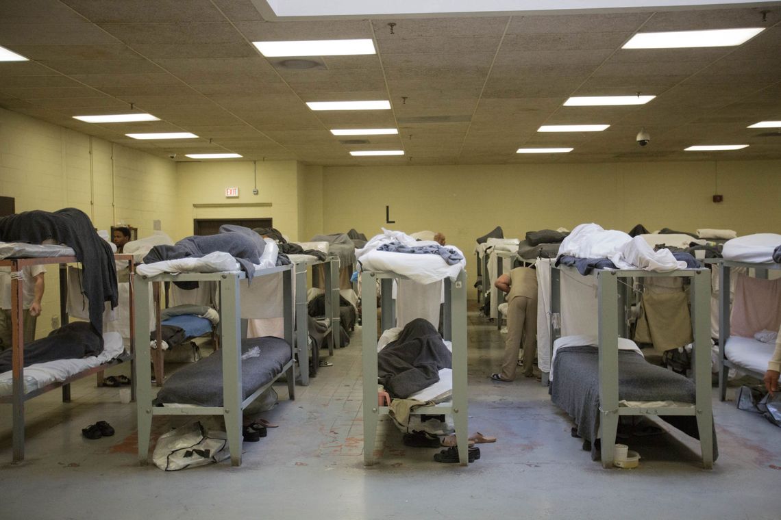 Men sleep on bunk beds in Division 4 of the Cook County Jail. 