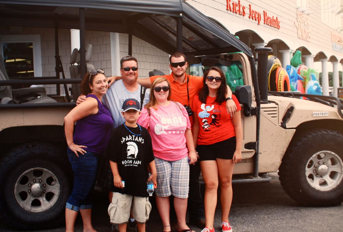 Allen O’Shea with, clockwise from left, stepmother Marie, his father Bill, stepsister Zoe, and half-siblings Andrea and Brandon in a 2014 family portrait. 
