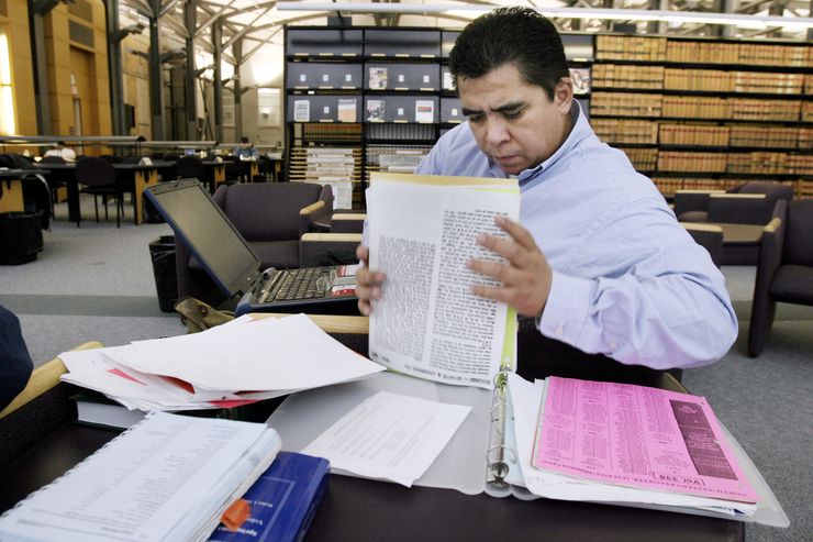 Chris Ochoa studies in the law library at the University of Wisconsin in Madison, Wisc., in 2004. Ochoa was wrongly imprisoned for murder and rape.