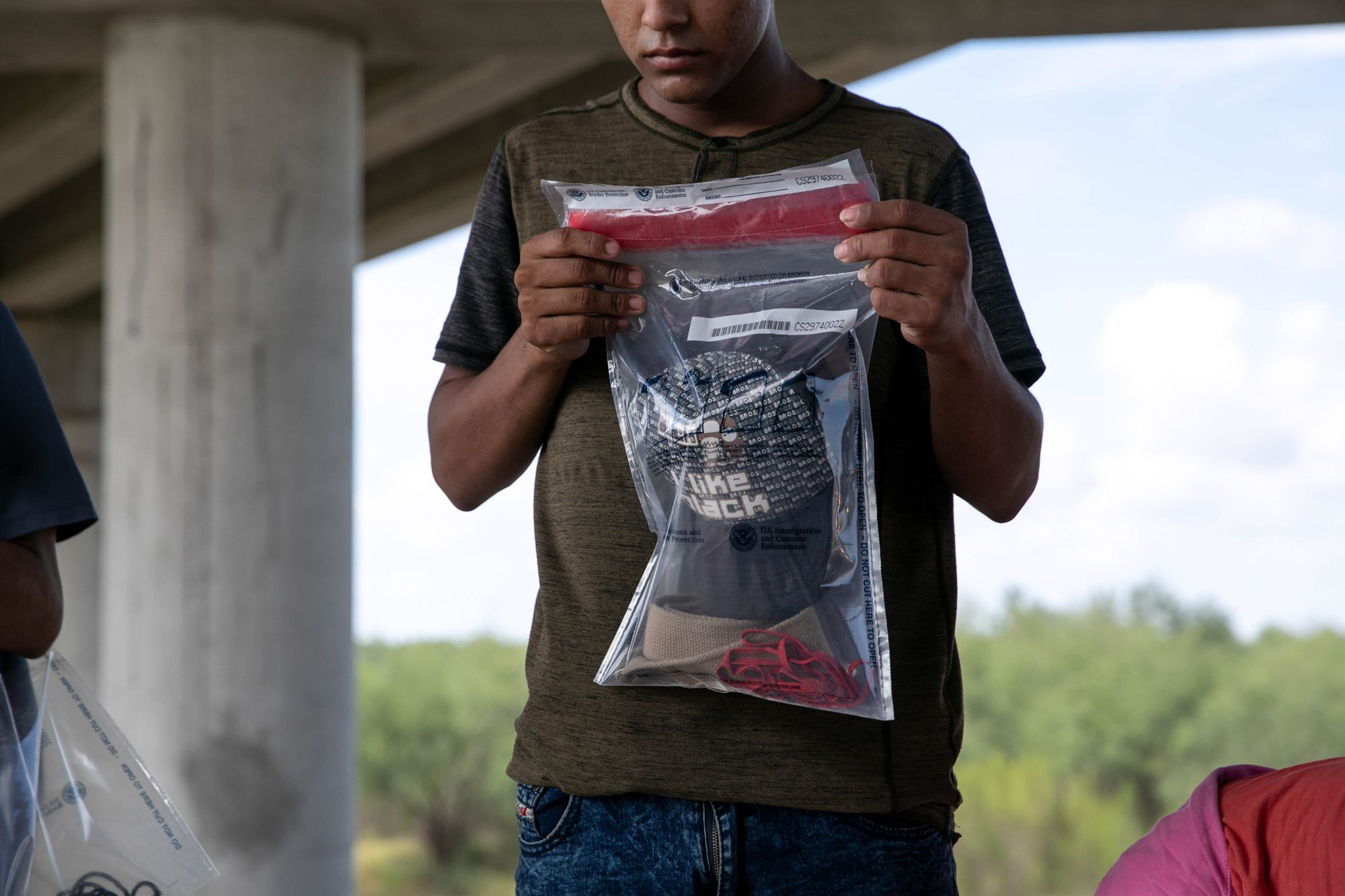 Migrants were given plastic bags for their belongings after they turned themselves in and were taken into custody. The Border Patrol made 37,544 apprehensions along the southwest border in August.