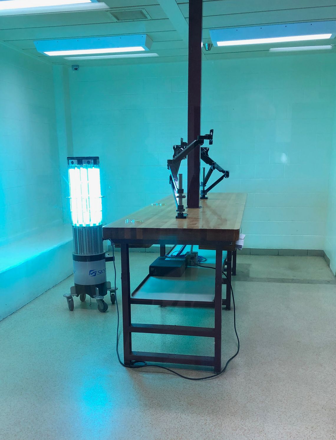 A robot emits high-intensity ultraviolet light in a booking room at the Kent County Jail in Grand Rapids, Michigan. 