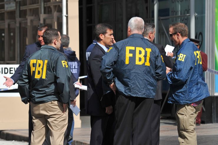 FBI agents  investigate a shooting in front of the Empire State Building August 24, 2012 on Fifth Avenue in New York. A gunman and one other person were killed and numerous others wounded Friday during a mass shooting at rush hour outside New York’s Empire State Building, police said. Streets around one of the Big Apple’s biggest attractions were closed as police flooded the area.  A disgruntled former employee at a women’s apparel shop shot a former co-worker outside the Empire State Building before being killed by police, officials said Friday in the first detailed account of the mayhem. In total, two people were killed and nine wounded, Police Commissioner Ray Kelly told a news conference. The shooter was identified as Jeffrey Johnson, 53, and his victim was aged 41, Kelly said. AFP PHOTO/STAN HONDA        (Photo credit should read STAN HONDA/AFP/GettyImages)