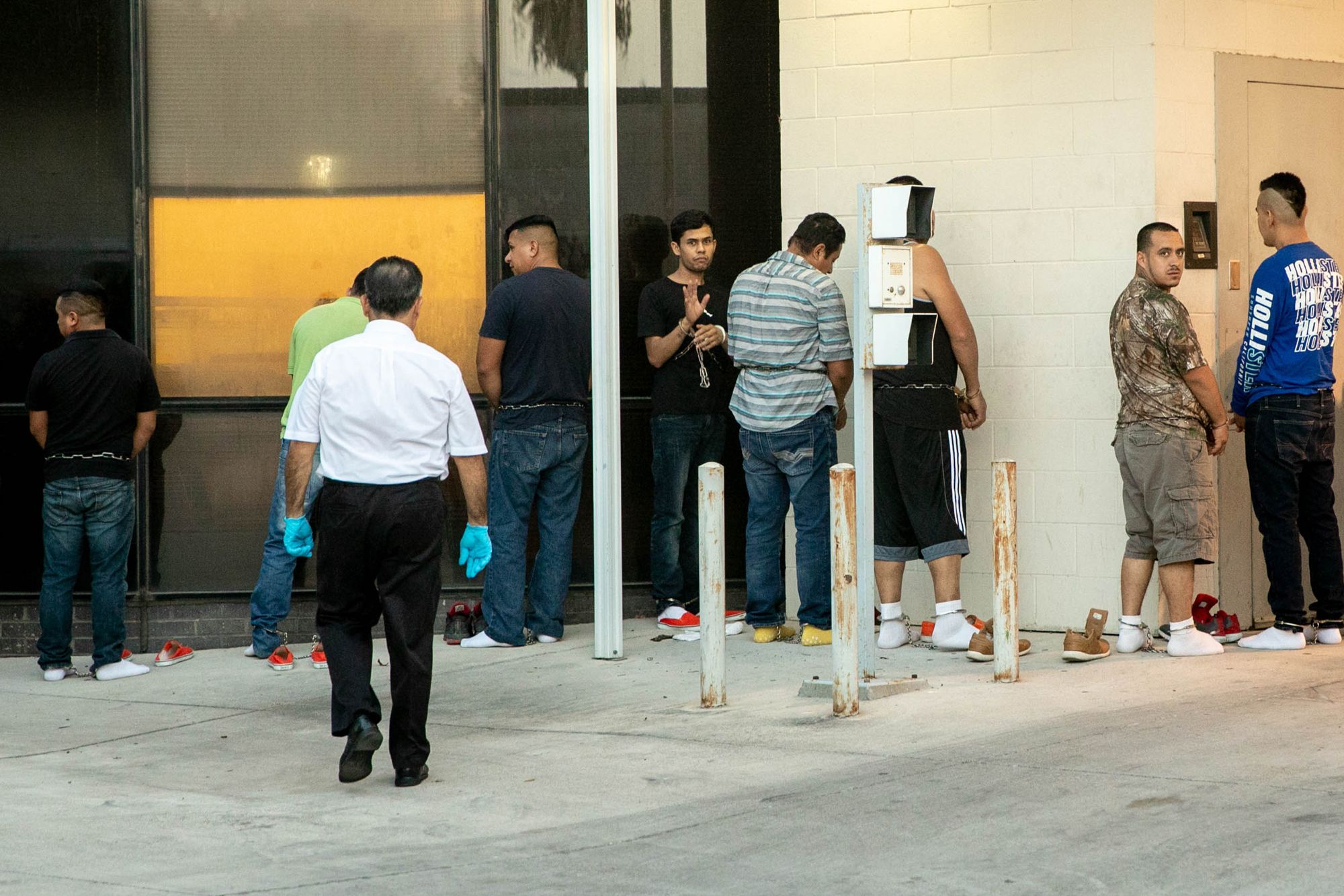 Migrants undergo a security check by U.S. Marshals before entering the courthouse, where they will be taken to a hearing to be prosecuted for the misdemeanor of illegal entry.
