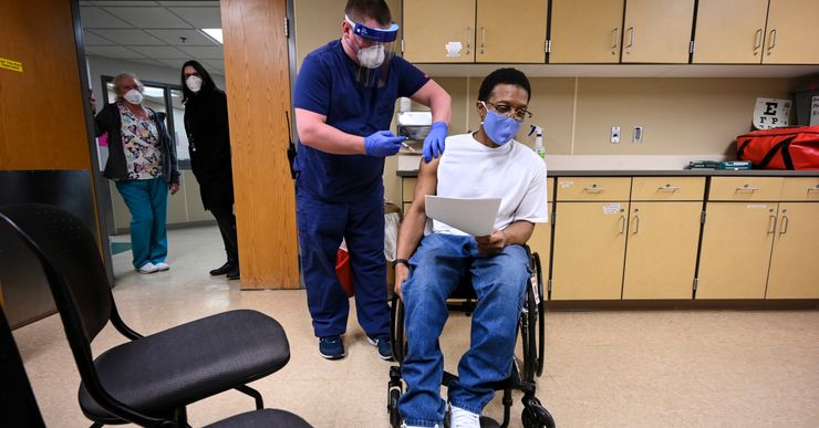 Kelly Markham, an RN supervisor at Faribault Prison, administered a COVID-19 vaccination to a medically vulnerable incarcerated person, Edward Anderson, in January in Faribault, Minn. 