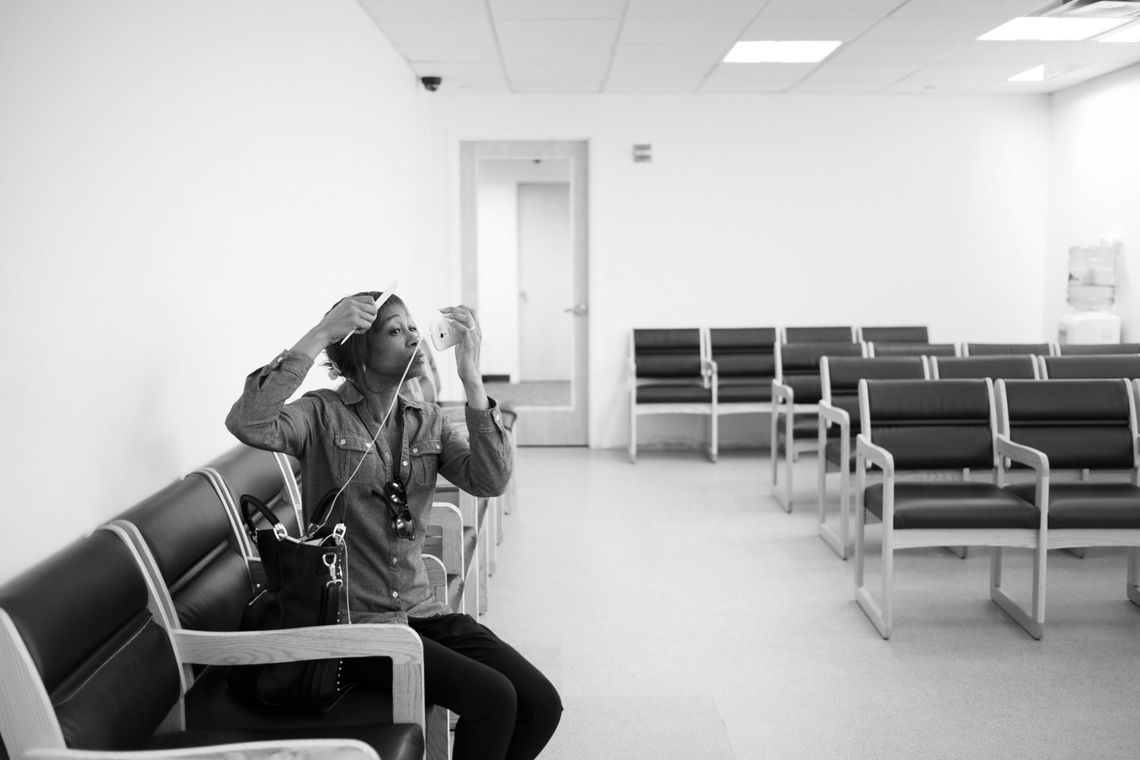 Tracy waits to meet with her counselor in Brooklyn. 