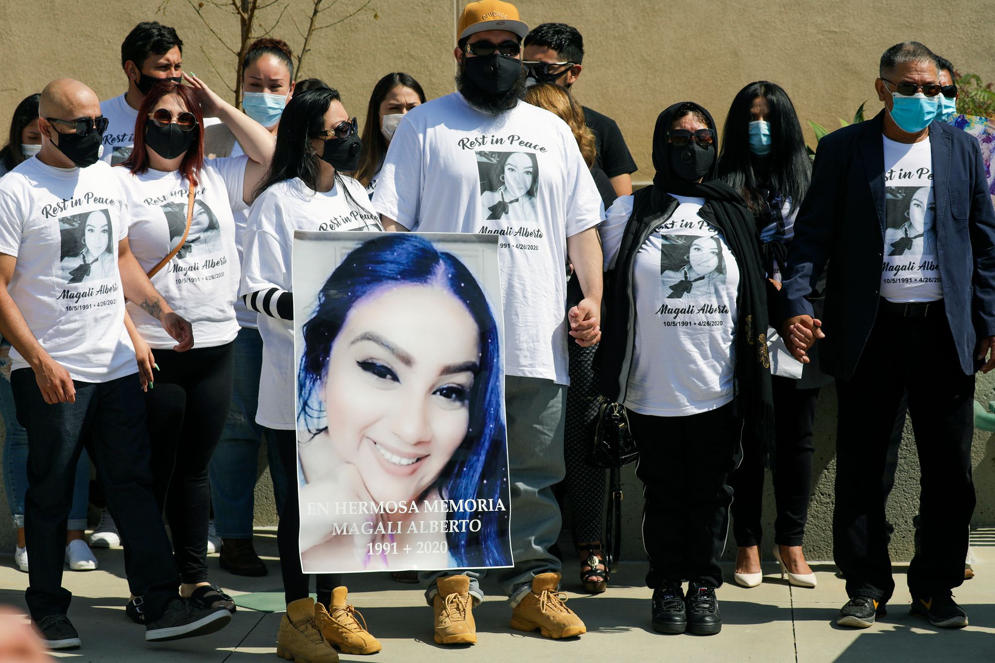 Family members of Magali Alberto, who was shot and killed at a traffic light, at a press conference held by the Los Angeles Police Department on May 28, 2020.