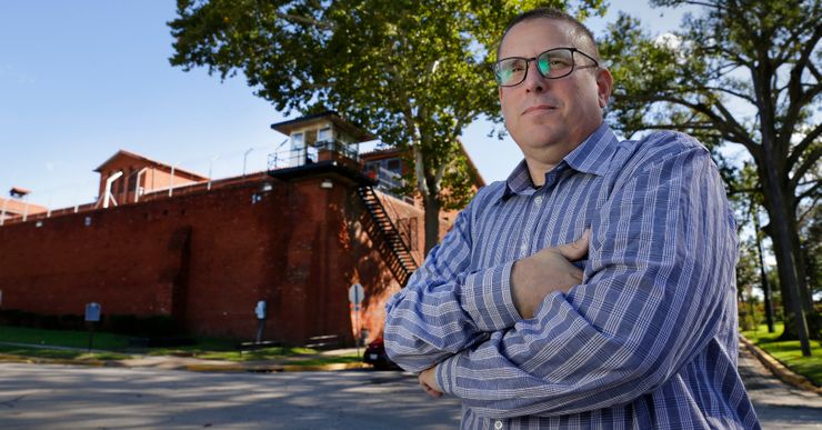 Lance Lowry, who recently retired after 20 years as a corrections officer, outside the Huntsville Unit in Texas.