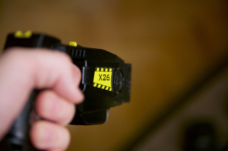 Retired LAPD Sergeant Greg Meyer points a TASER X26 in “KILLING THEM SAFELY.”