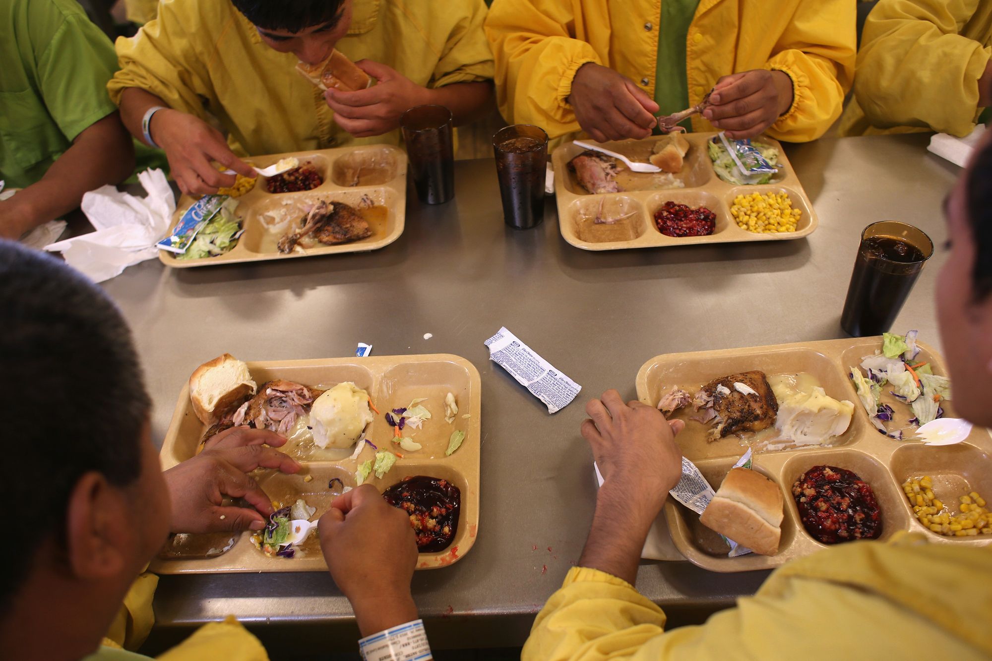 Detainees eat lunch at the Immigration and Customs Enforcement detention facility in Florence, Ariz., on Feb. 28, 2013.