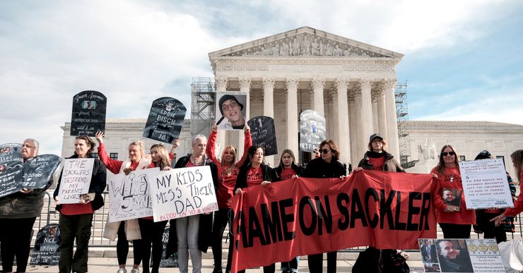 People gathered in front of the U.S. Supreme Court in Washington, D.C. on  Dec. 4, 2023 to protest a nationwide settlement with Purdue Pharmaceuticals, the manufacturer of OxyContin.