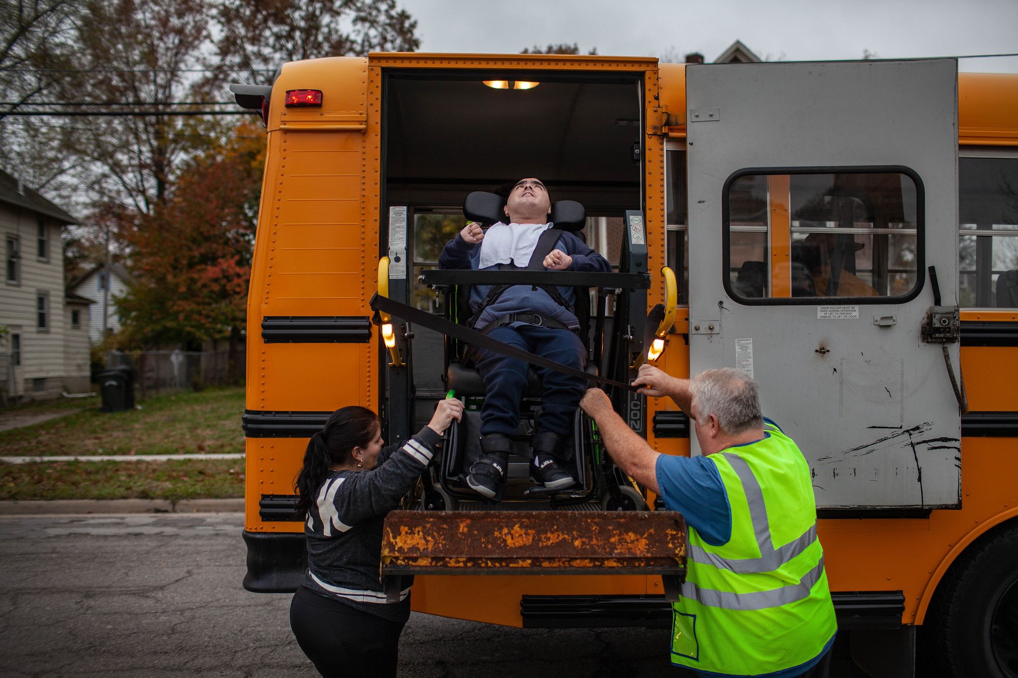 Seleste helped Juan board the bus, which stopped in front of their home last October. All of his outside activities have been cancelled because of the coronavirus. 
