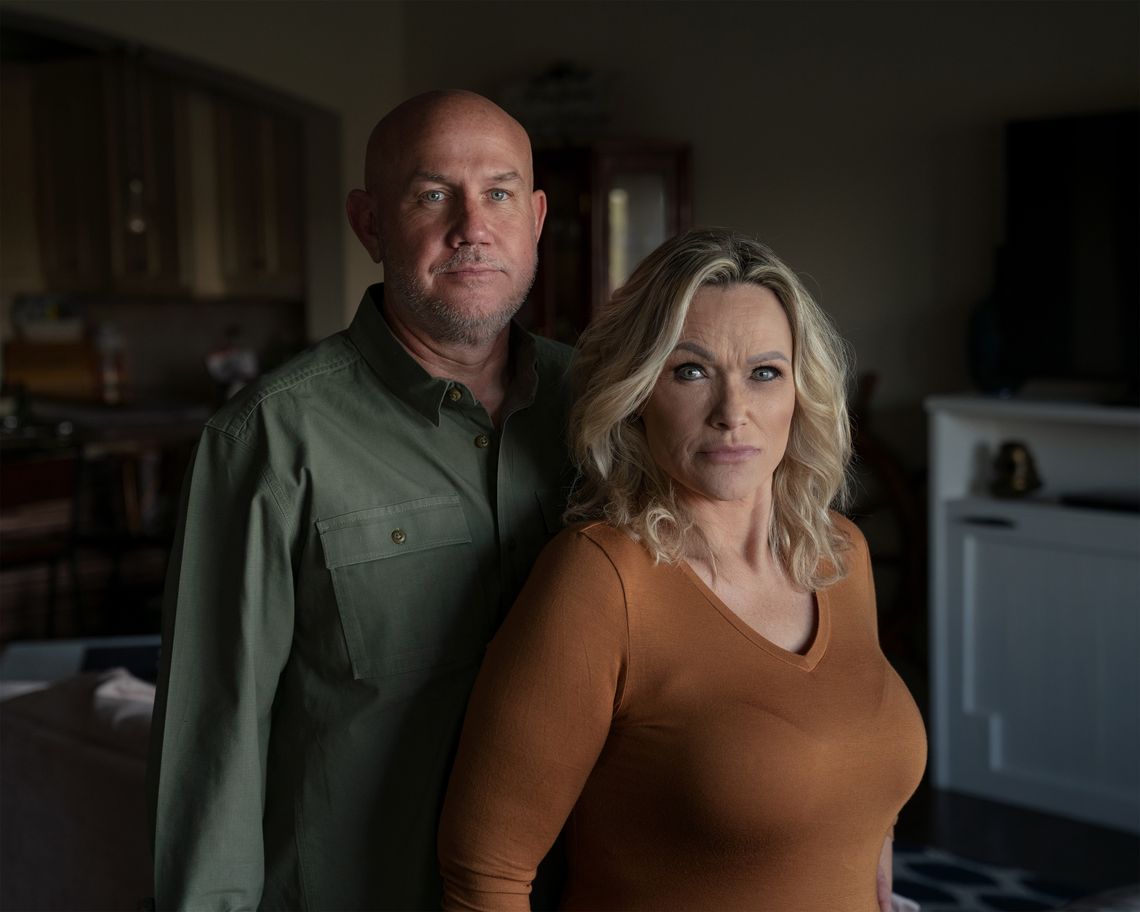 Melinda Brewer with her husband Wayne at their home in 2021. The Brewers worked in the Texas prison system for more than 20 years.