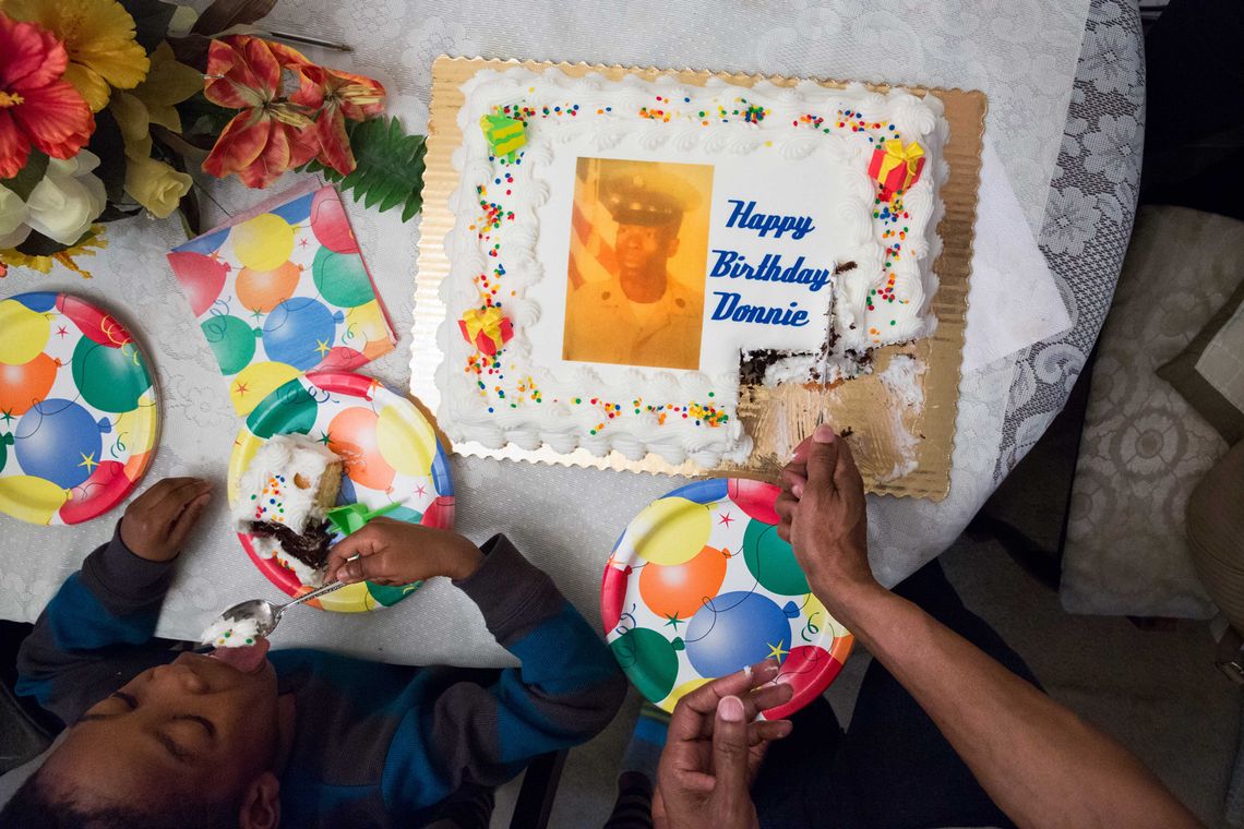 Elston cut into his 59th birthday cake, a few months after his release.