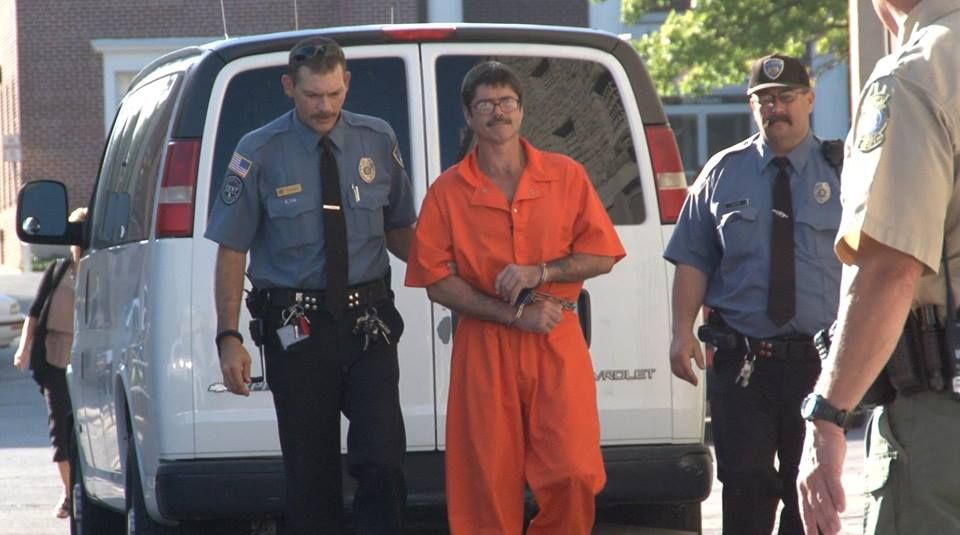 Jessie McKim steps off a transport vehicle for day two of his evidentiary hearing in 2013.