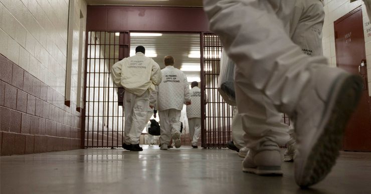 In this Jan. 18, 2011 photo, inmates at William E. Donaldson prison in Bessemer, Ala., return to their cells after completing meditation classes. Vipassana is a meditative technique that dates back 2,500 years to Gotama Buddha. Vipassana courses are held four times a year in the prison gymnasium, where as many as 40 inmate volunteers meditate 10 hours a day and live for the duration. (AP Photo/Dave Martin)