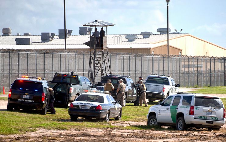 Law enforcement officials outside the Willacy County Correctional Center in Raymondville, Texas on Feb. 20. 