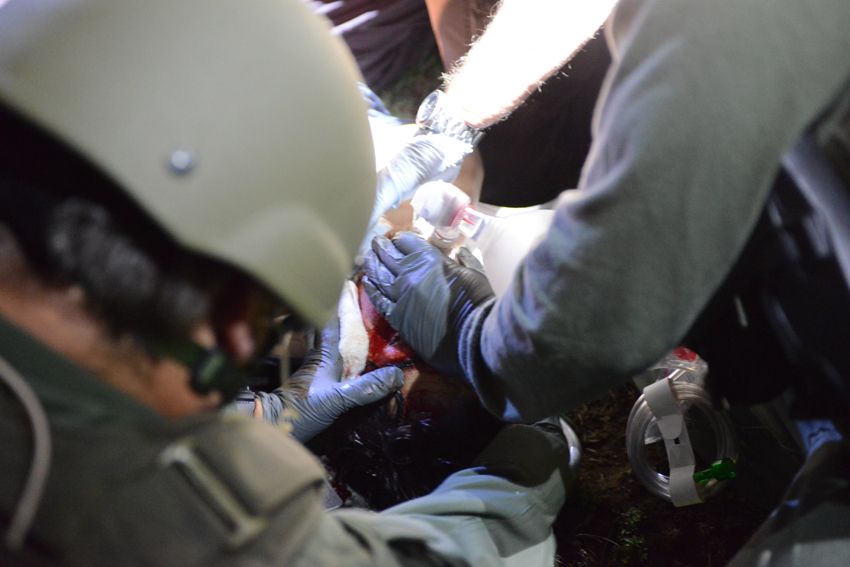 Police medics attend to Dzhokhar Tsarnaev at the scene of his arrest.