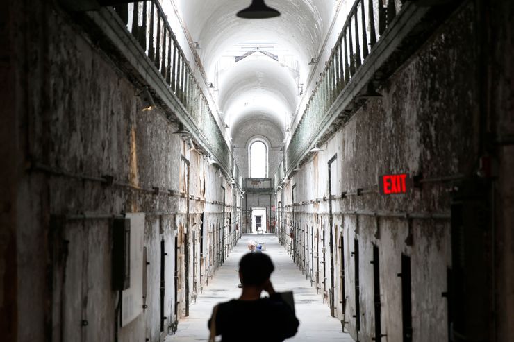 A visitor takes a photograph of a cellblock at Eastern State Penitentiary in Philadelphia, Pa. in April.