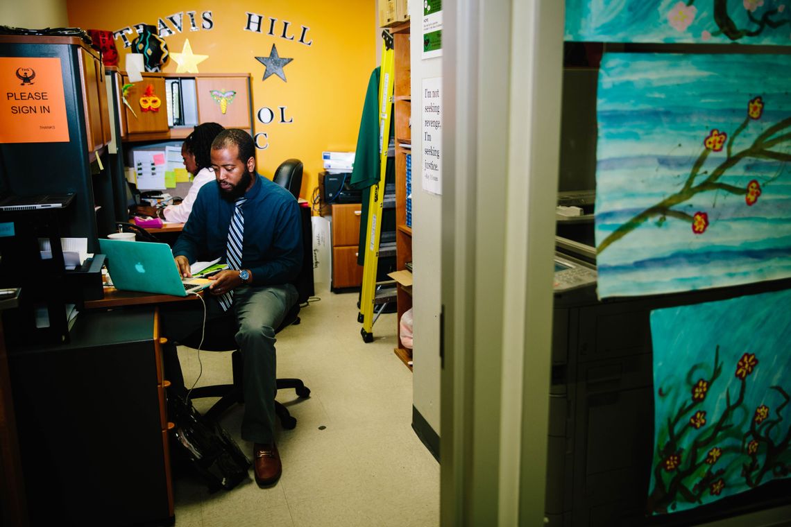 Travis Hill School Principal Mario Myles works in his office. 