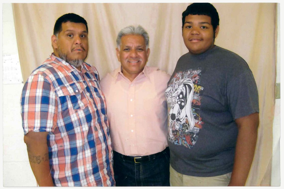 Rodriguez, center, with his son, left, and grandson, right, in June 2015. 