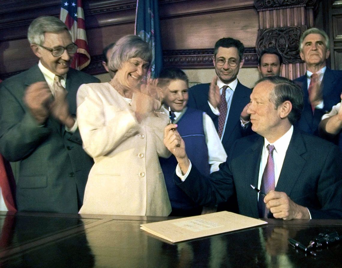 New York Gov. George Pataki with Patrica Webdale and Ralph Webdale after signing Kendra's Law in 1999, at the state Capitol in Albany, N.Y. 