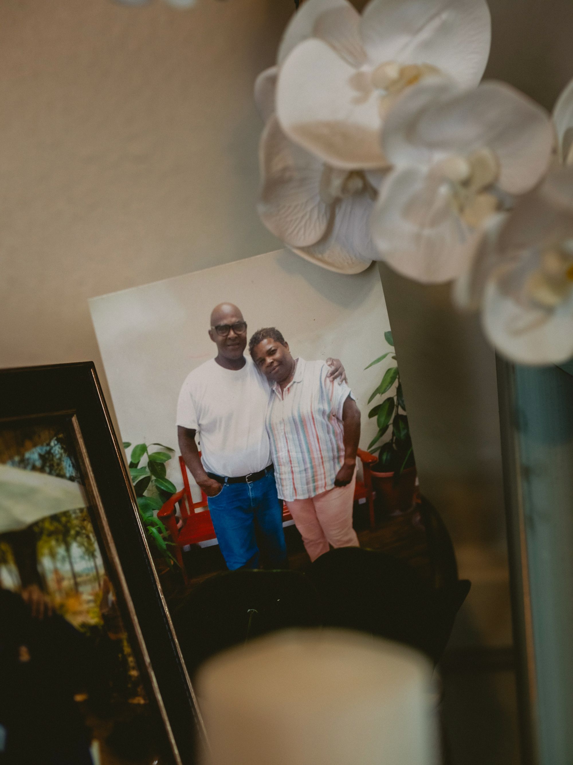 Raymond, a Black man, and Cassandra, a Black woman, in a picture of them from a visit to prison.