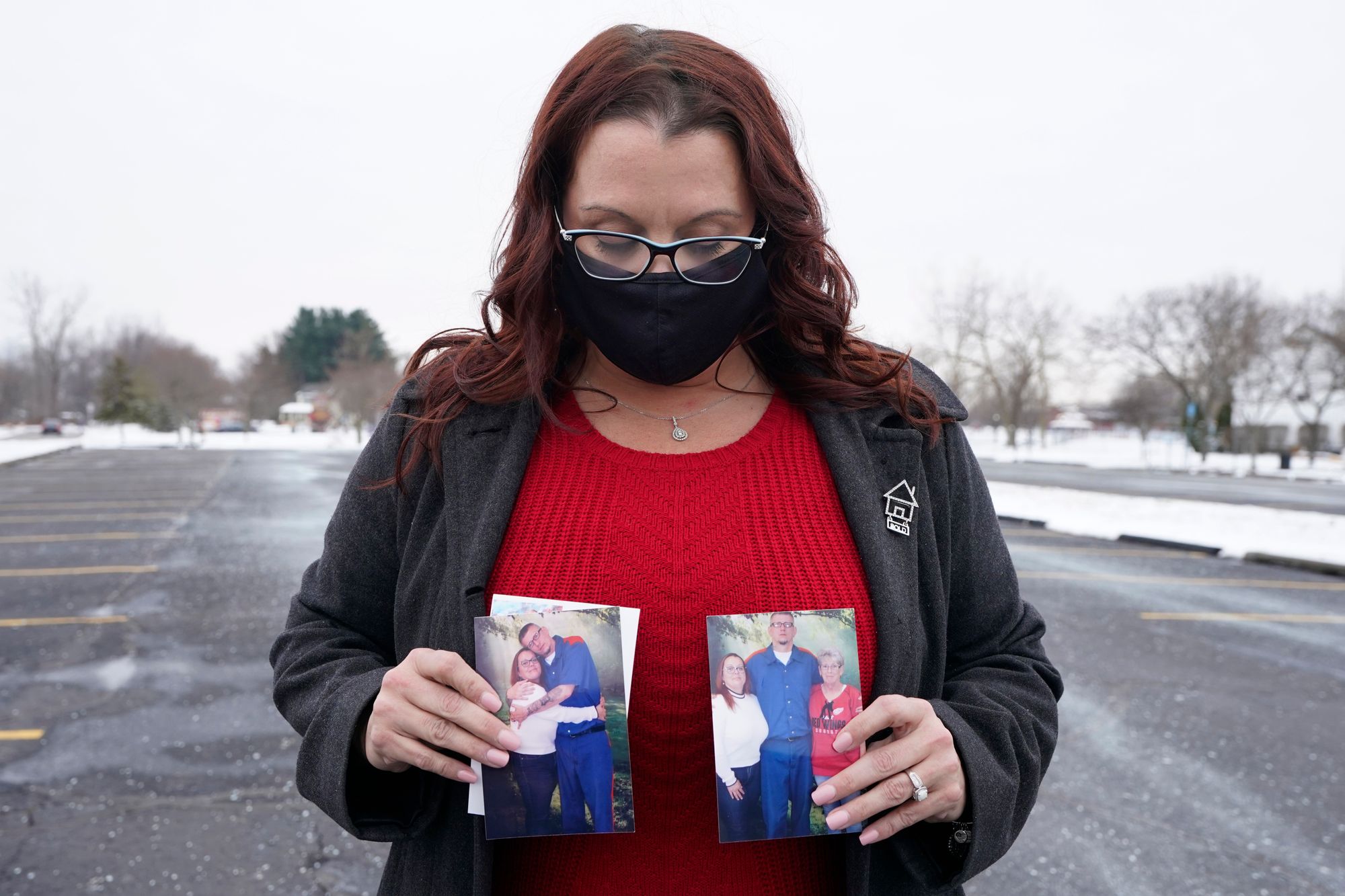 Jennifer Gross holds photos of herself with fiancé Robert Vermett, who is incarcerated at Michigan’s Kinross Correctional Facility and recovering from COVID-19.