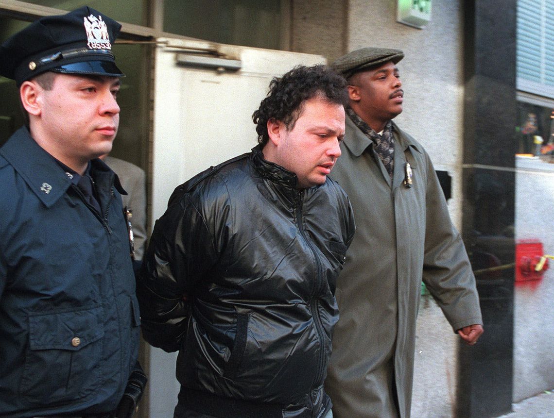 Andrew Goldstein, 29, of Howard Beach, Queens, center, is escorted by police officers out of New York’s 13th Precinct in January 1999, after being arrested for pushing Kendra Webdale to her death under a Manhattan subway train.