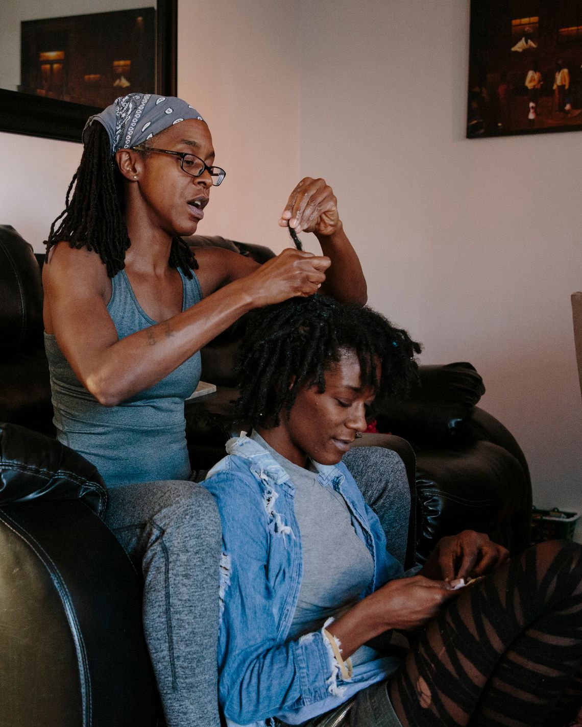 Charnal shares a moment with her mother, Lashonia Thompson-El (left), in her home after looking through baby images together for the first time on Dec.12, 2020. 