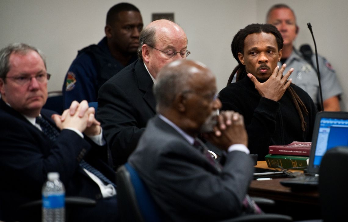 Quintel Augustine, right, sat with his defense team during the closing arguments of a Racial Justice Act hearing at the Cumberland County Courthouse in 2012.