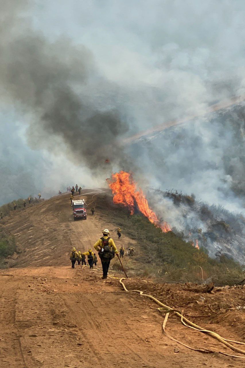 Fire crews assist with burning operations at the Moc Fire in Camarillo, California, on August 24. 