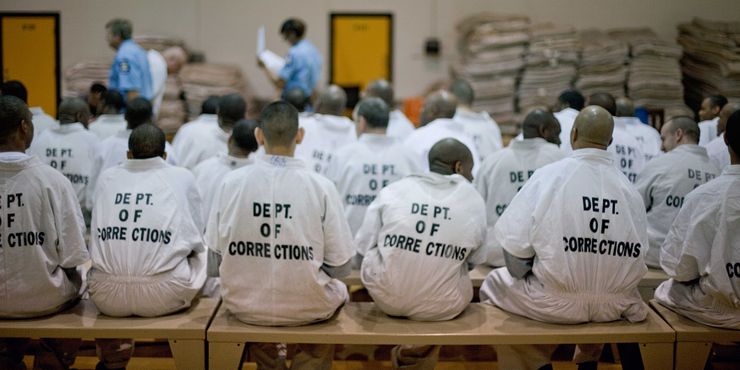 Newly arrived prisoners wait to be processed at the state prison in Jackson, Georgia, in 2011.