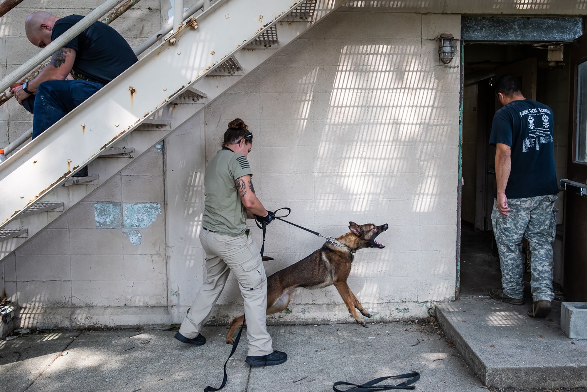 Mary Rose Kendall, with the Bolingbrook, Illinois, Police Department, prepares to continue bite training with her dog at Vohne Liche Kennels in Peru, Indiana, on Sept. 9, 2020. Vohne Liche trainers teach the ‘find and bite’ method for search and capture. 