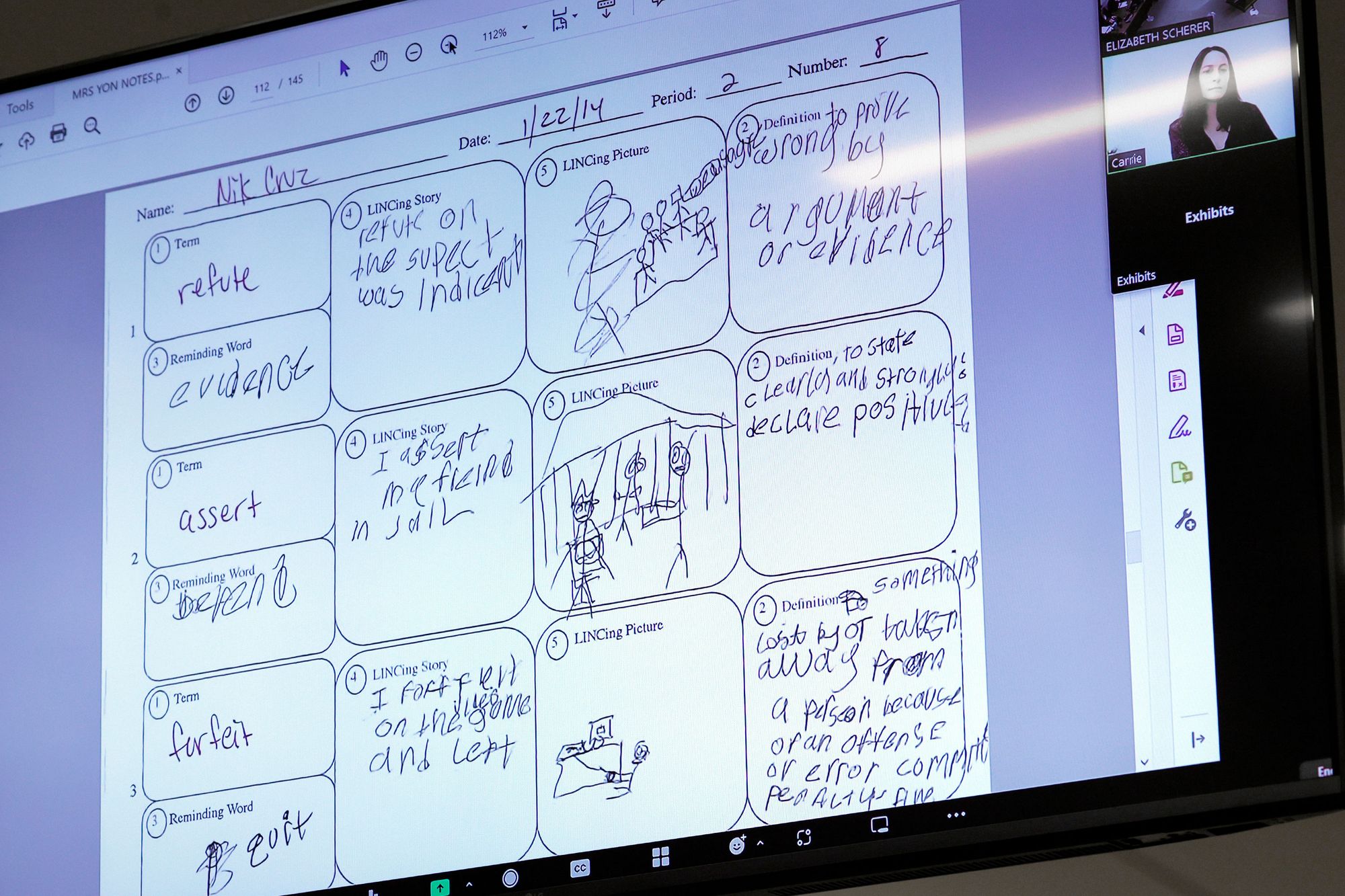 A photo of drawings on a school worksheet, seen through a video call projection. 