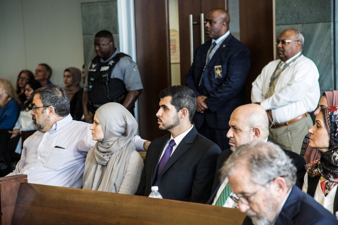 Relatives of the victims, including from left, Nami Barakat, Suzanne Barakat, Dr. Yousef Abu-Salha and Dr. Mohammed Abu-Salha, attend Hicks' sentencing hearing at the Durham County Courthouse.