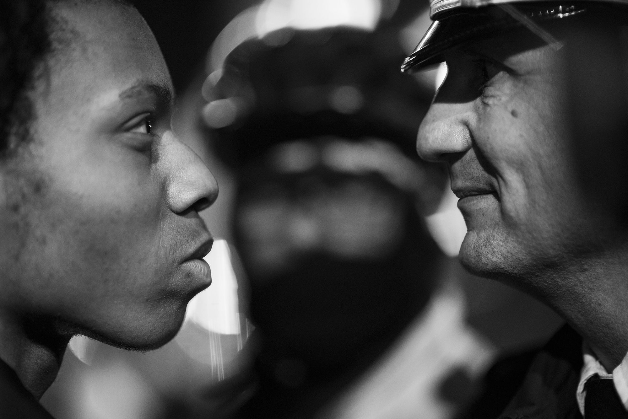 A protestor stands face-to-face with a police officer on November 24, 2015 during a march through downtown Chicago. The protests were a result of the killing of Laquan McDonald by officer Jason Van Dyke.