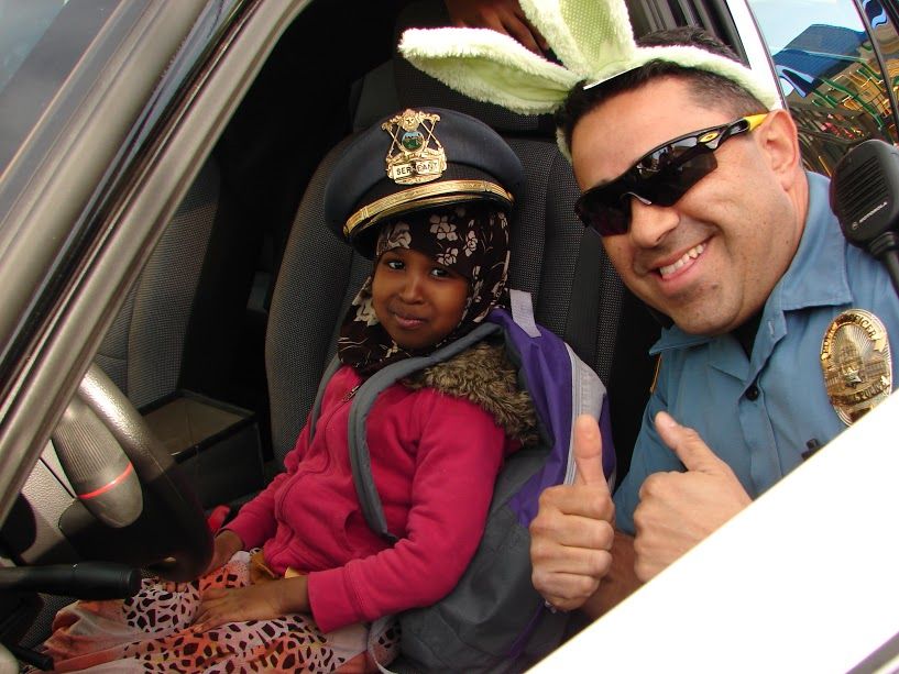 A member of the St. Paul Police Department during a police-sponsored Halal cookout.