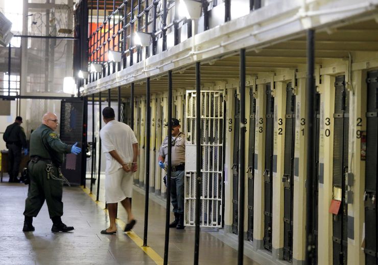 A condemned inmate is led out of his cell on death row at San Quentin State Prison in San Quentin, California in 2016.