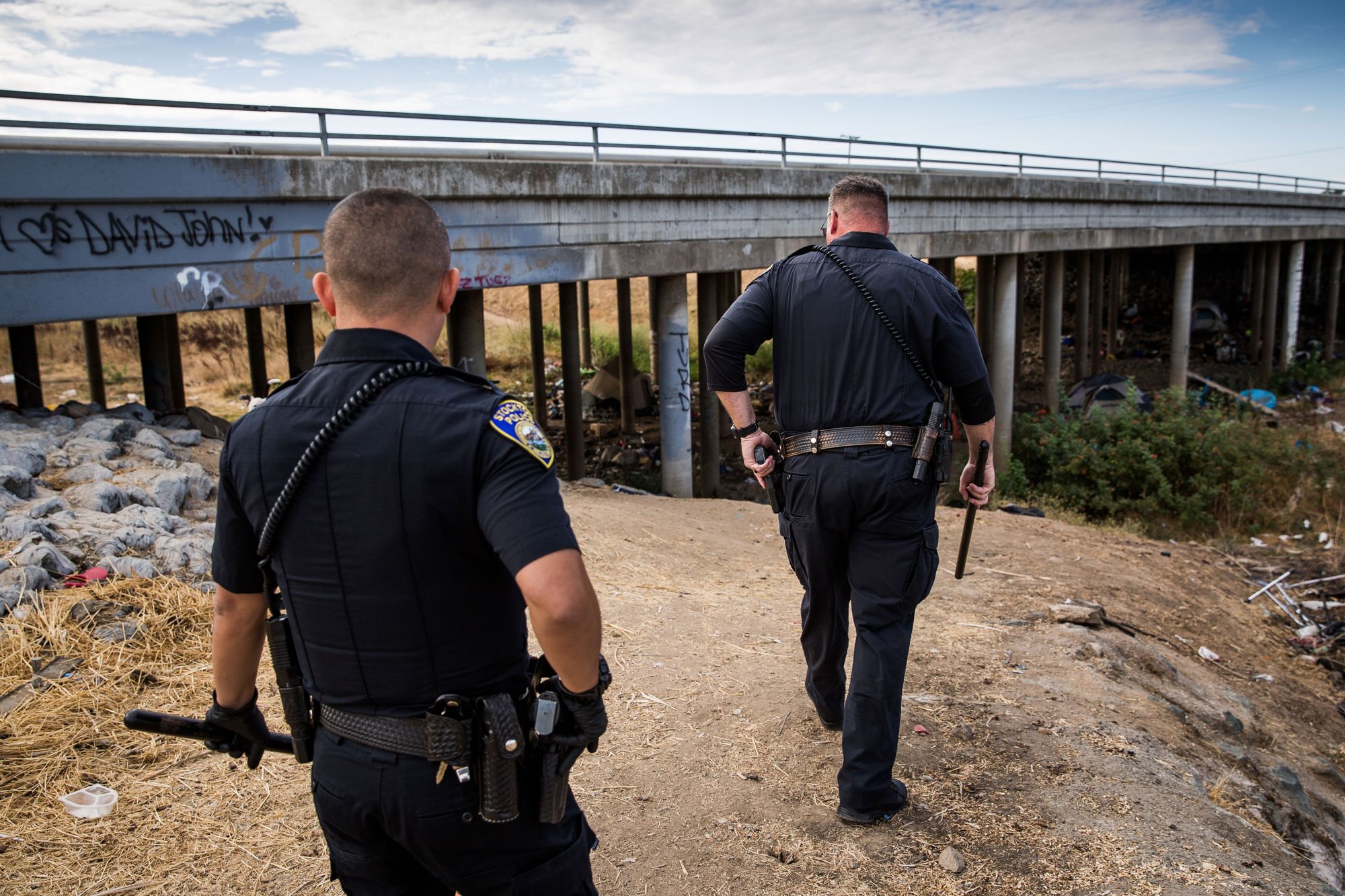 Stockton Police Collaborative Court Officer Jason DiGiulio, right, and Officer K. Saetern look for a client who violated probation.  