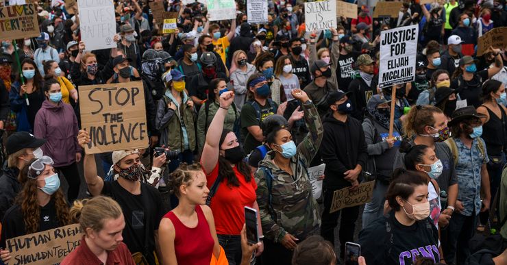 People march in the street to protest the death of Elijah McClain on July 25, 2020 in Aurora, Colorado. On August 24, 2019 McClain was walking home when he was forcibly detained by three Aurora police officers and was injected with ketamine after officers requested assistance from the Aurora Fire Rescue. McClain suffered a heart attack on the way to the hospital that night and died six days later.